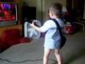 3 year old playing Guitar Hero